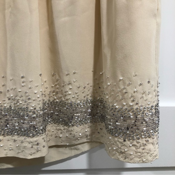 Club Monaco cream mini skirt with gray white beaded trim on bottom. Size 00. - Picture 5 of 6